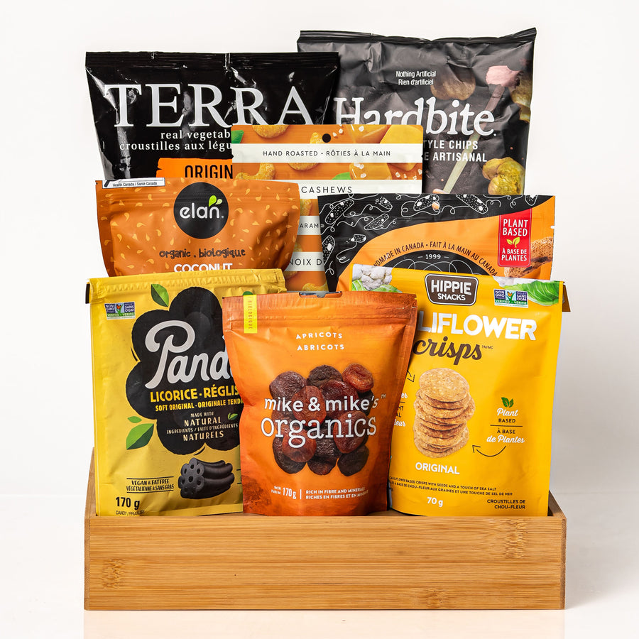 Vegan & Vibrant: a deep bamboo tray with Terra and Hardbite chips, Elan coconut, Panda licorice, Mike & Mike's organic apricots, Hippie Snacks cauliflower crisps and cashews