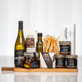 Antipasto Board gift with white wine, olive oil, grissini, brie and antipasto in patterned boxes
