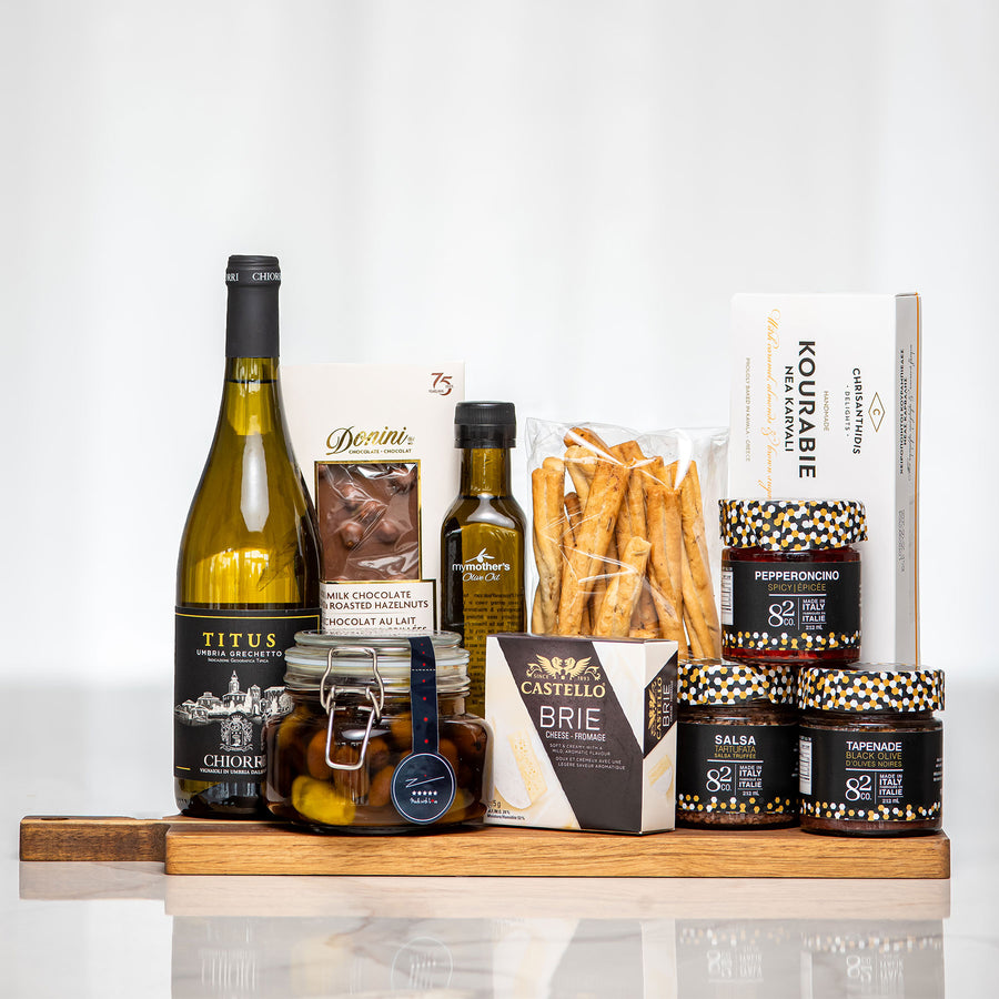 Antipasto Board gift with white wine, olive oil, grissini, brie and antipasto in patterned boxes