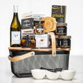 Artisan Collection large basket with white wine, grissini, preserves, a cheese board and bowls