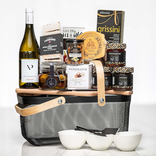 Artisan Collection large basket with white wine, grissini, preserves, a cheese board and bowls