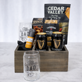 Brews & Bites Father's Day gift crate with two Guinness Draught Stout cans, Best Dad Ever beer glasses, Spanish salami, pita chips and shortbread in a wooden crate