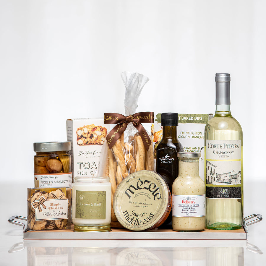 Chef du Cuisine gift tray with a candle, mustard, olive oil, cookies and a bottle of white wine