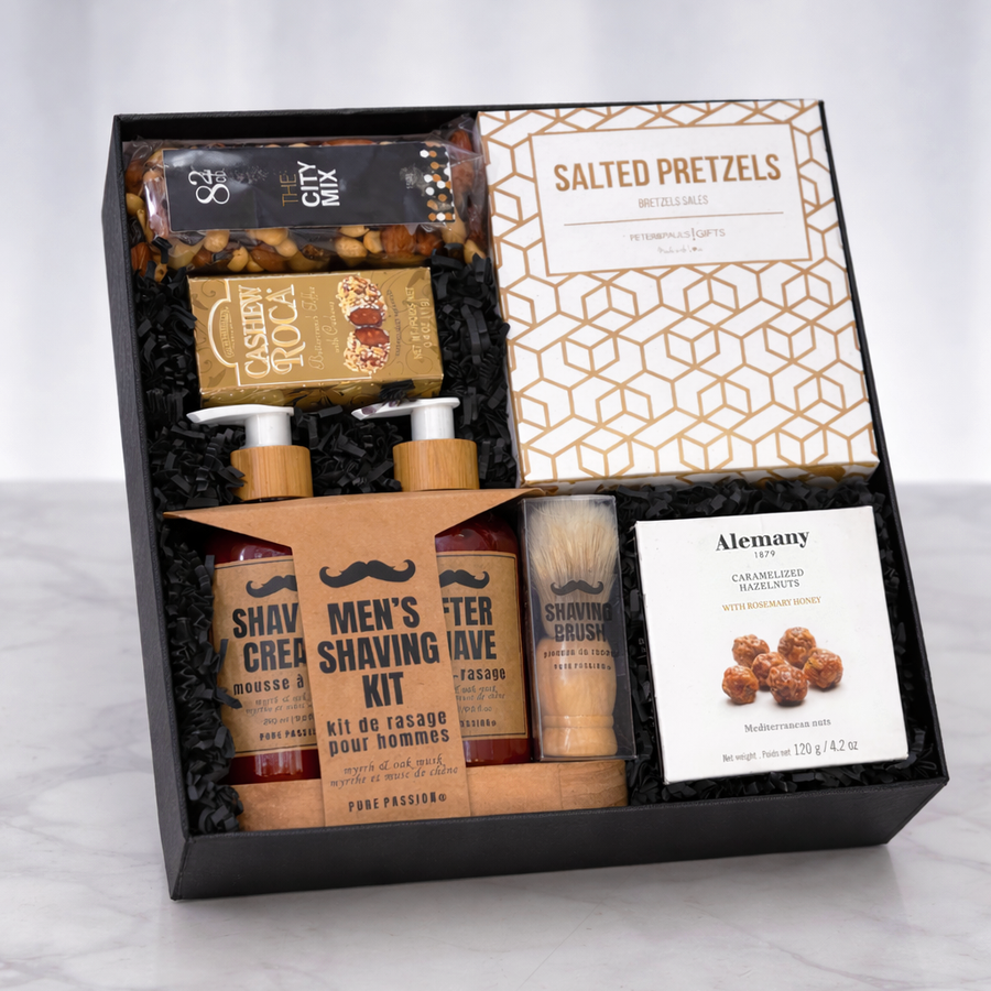 The Gentleman's Box Father's Day gift with men's shaving kit, salted pretzels, caramelized hazelnuts and nuts in a black gift box