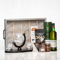 Globetrotter gift crate with a desk globe, whisky glasses, nuts and a bottle of Glenfiddich