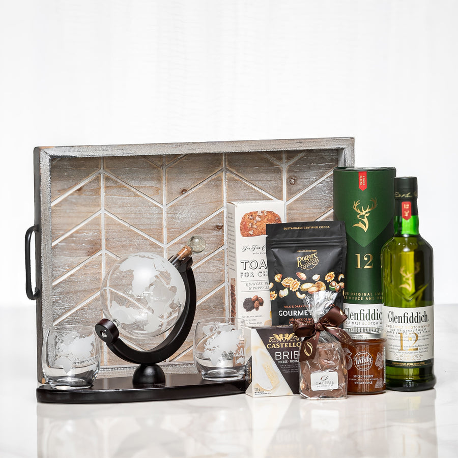 Globetrotter gift crate with a desk globe, whisky glasses, nuts and a bottle of Glenfiddich