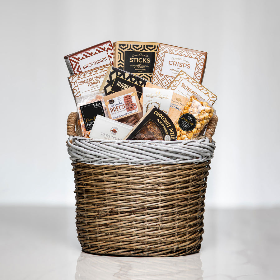 Hearty Hamper large woven basket with charcuterie sticks, crackers, chocolates and gourmet snacks
