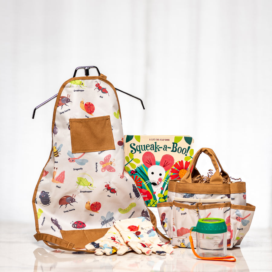 Little Explorer kids' gardening gift with a bug-patterned apron, tool bag and gloves, a Squeak-a-Boo! flap book and a Hape bug jar