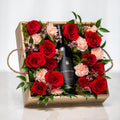 Rose Garden gift crate with a bottle of wine set among red and pink roses in a wooden tray