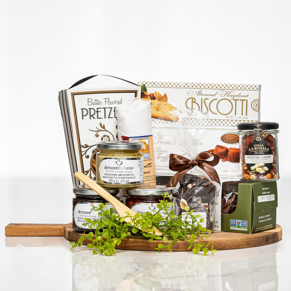 Round the Table gift board with pretzels, biscotti, preserves, chocolates and a wooden spoon