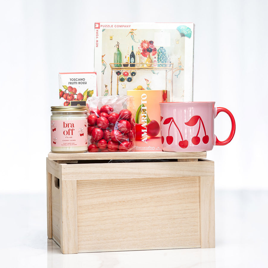 Sit Sort and Savour gift crate with a puzzle, a tea towel, cherry print mugs and preserves