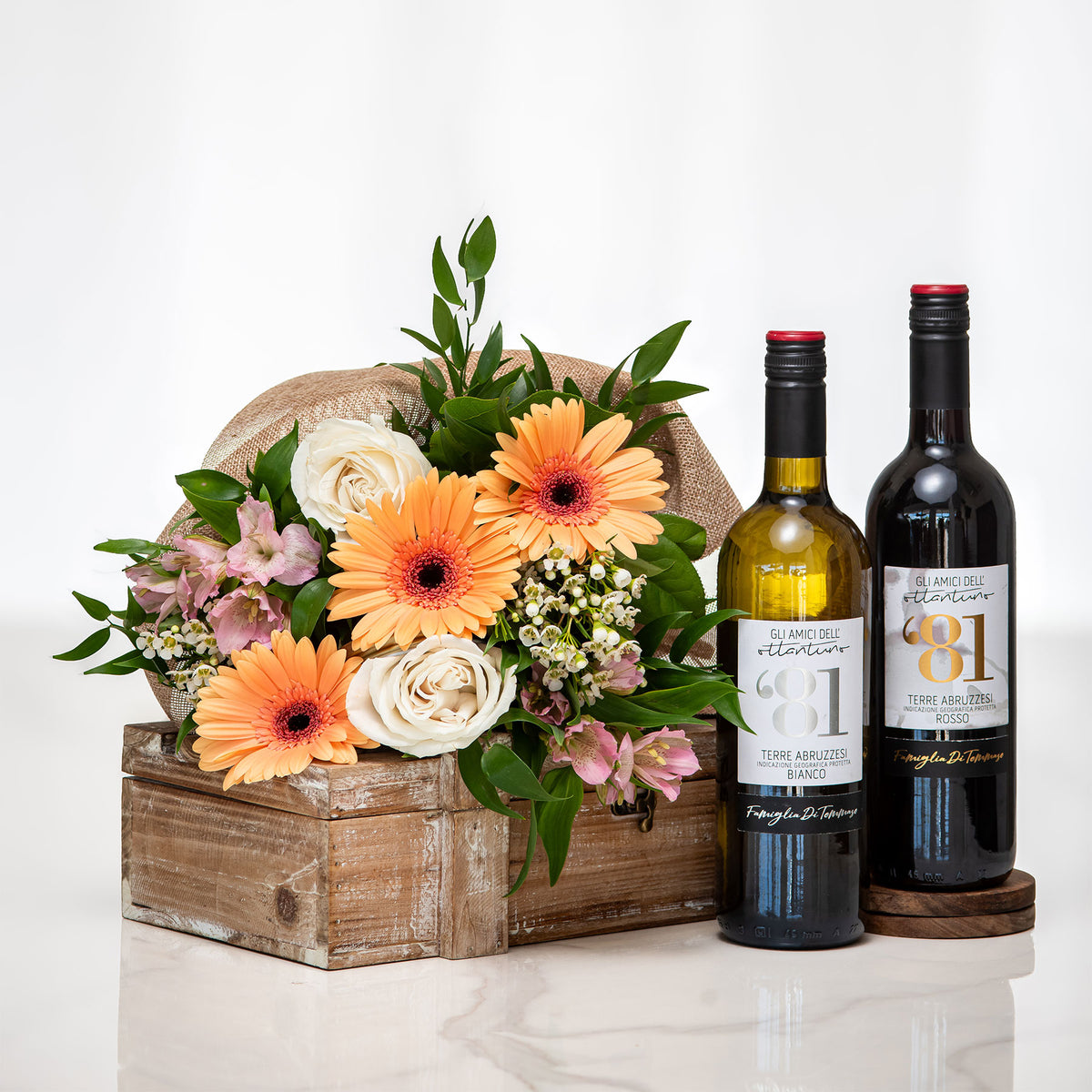 Twice as Nice small gift with two bottles of wine and a gerbera and rose arrangement in a wooden crate
