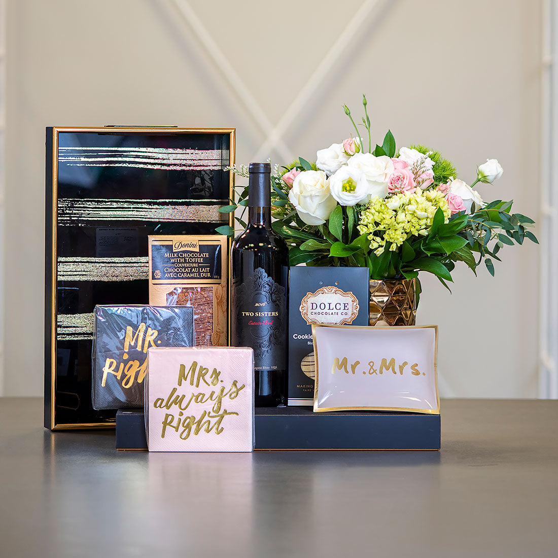 wedding gift set with wine, flowers, and chocolate toffee
